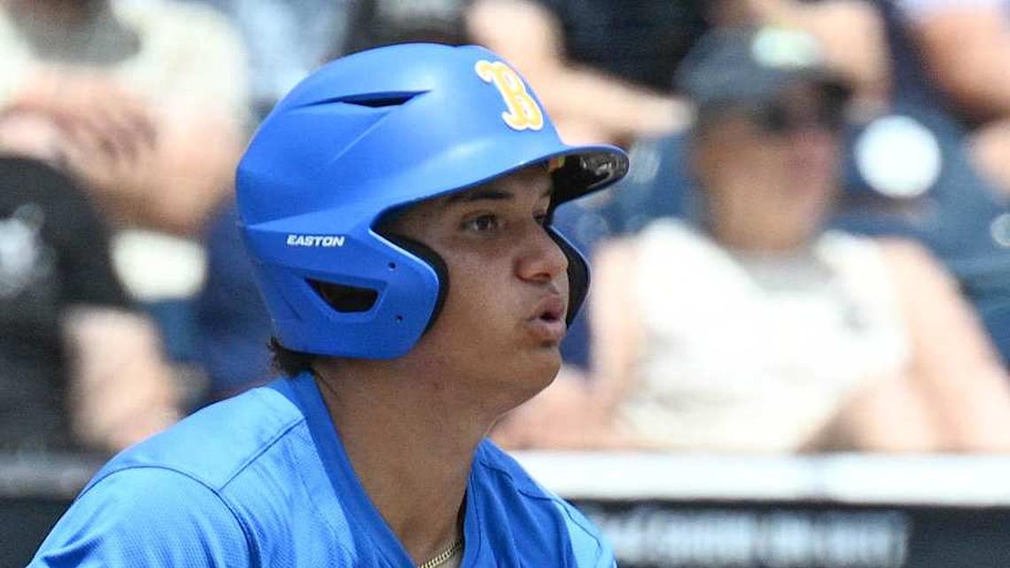  Jun 14, 2025; Omaha, Neb, USA; UCLA Bruins first baseman Mulivai Levu (39) singles against the Murray State Racers during the first inning at Charles Schwab Field. Mandatory Credit: Steven Branscombe-Imagn Images | Steven Branscombe-Imagn Images 