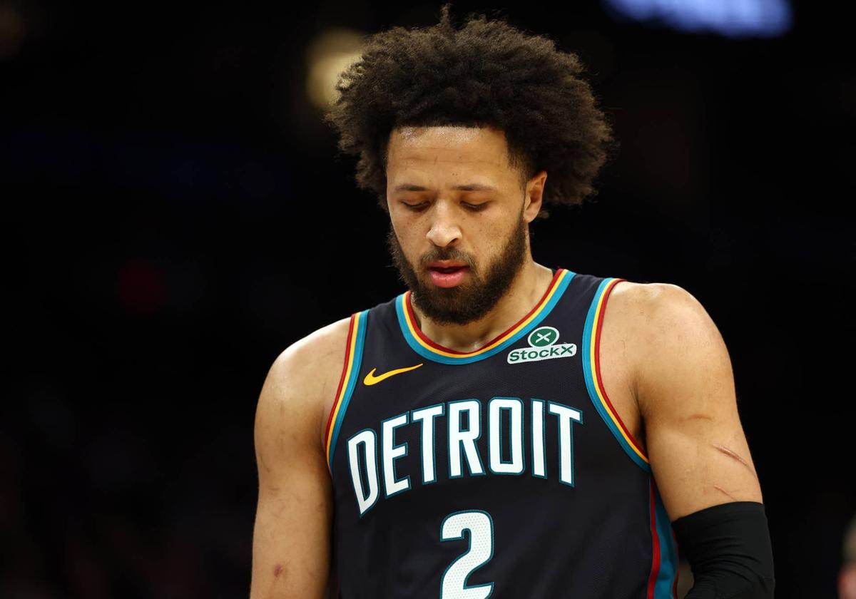  Detroit Pistons guard Cade Cunningham looks down during a game. © Mark J. Rebilas-Imagn Images