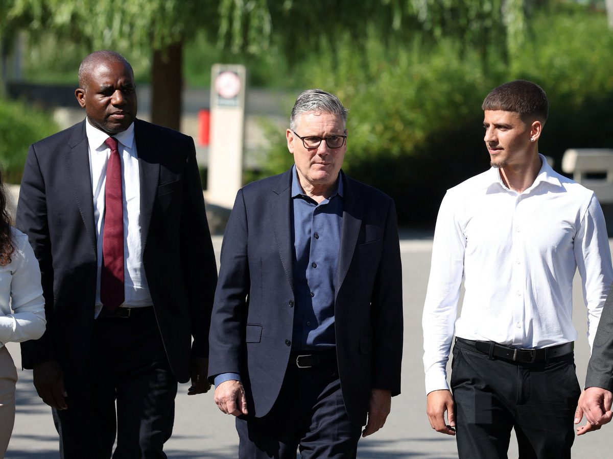Britain's Prime Minister Keir Starmer walks with British Deputy Prime Minister David Lammy as he visits a housing development in north London, Britain, June 19, 2026. Peter Macdiarmid/Pool via REUTERS