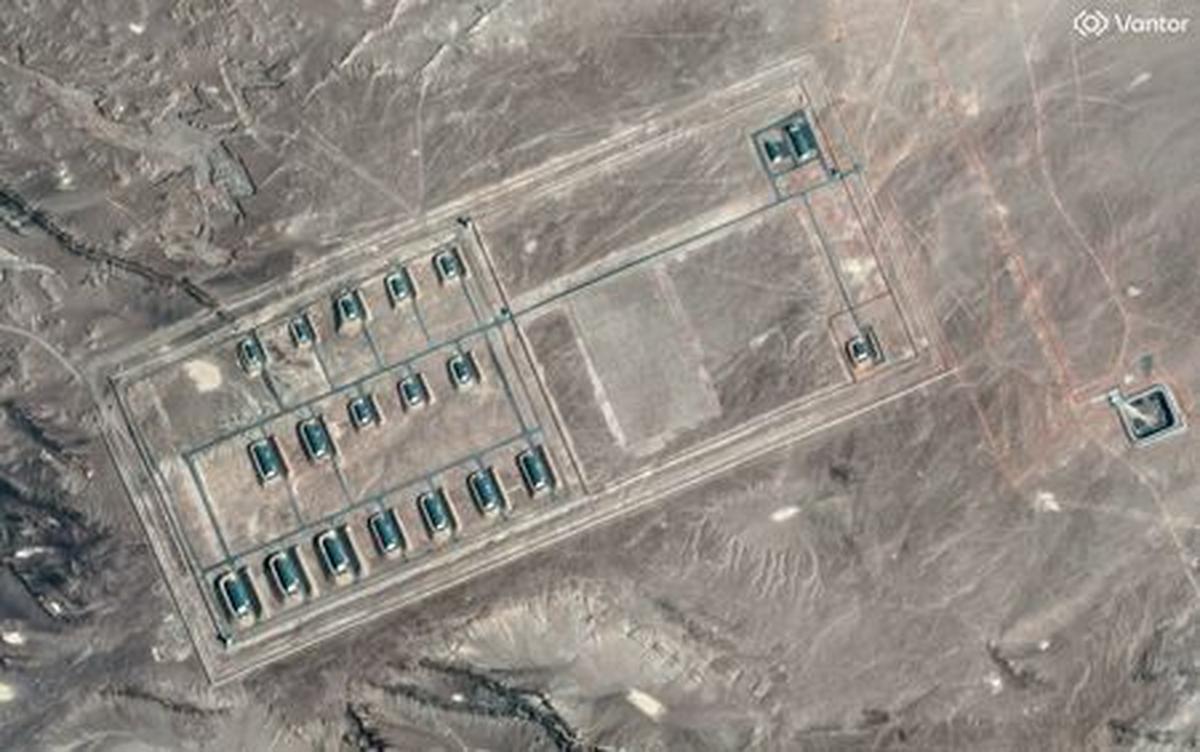 A satellite image shows what security analysts say is a fortified weapons storage installation, revealing revetments around the building, a perimeter wall and guard towers, in the Xinjiang Uyghur Autonomous Region, China, March 19, 2026.   Vantor/Handout via REUTERS