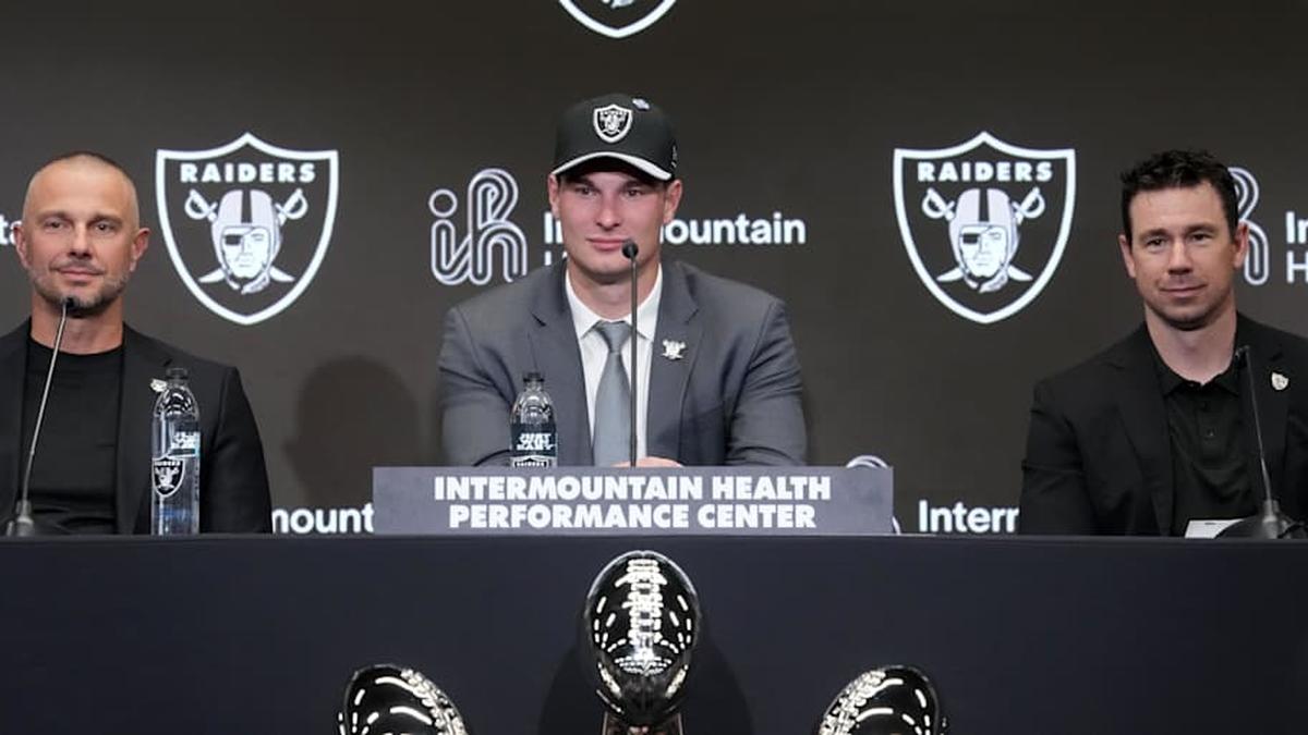  Apr 24, 2026; Henderson, NV, USA; Las Vegas Raiders quarterback Fernando Mendoza (center) speaks at introductory press conference at Intermountain Health Performance Center flanked by general manager John Spytek (left) and head coach Klint Kubiak after being selected as the No. 1 pick in the 2026 NFL Draft. Mandatory Credit: Kirby Lee-Imagn Images | Kirby Lee-Imagn Images 