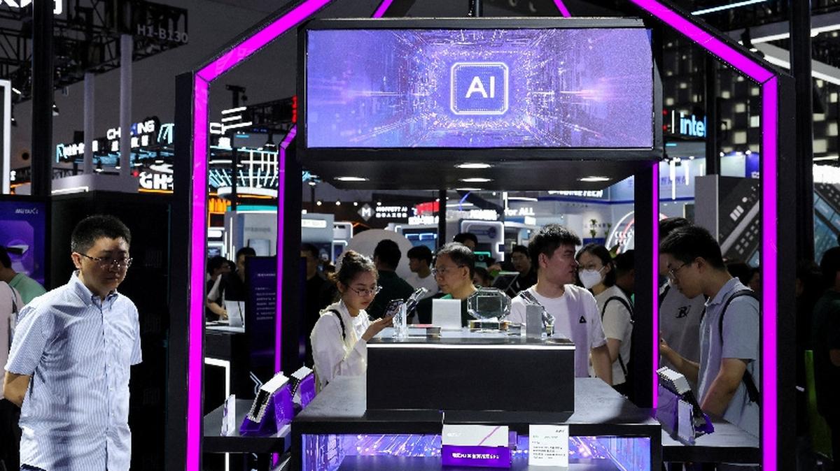 FILE PHOTO: People visit a Metax booth during the World Artificial Intelligence Conference in Shanghai, China July 26, 2025.  REUTERS/Go Nakamura/File Photo