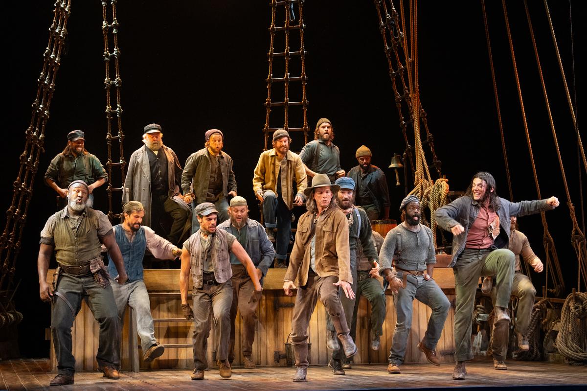 Stark Sands, center, in “Swept Away” at the Longacre Theater in Manhattan, on Oct. 28, 2024. The show’s cast delivered rousing renditions of the Avett Brothers’ rootsy Americana songs.