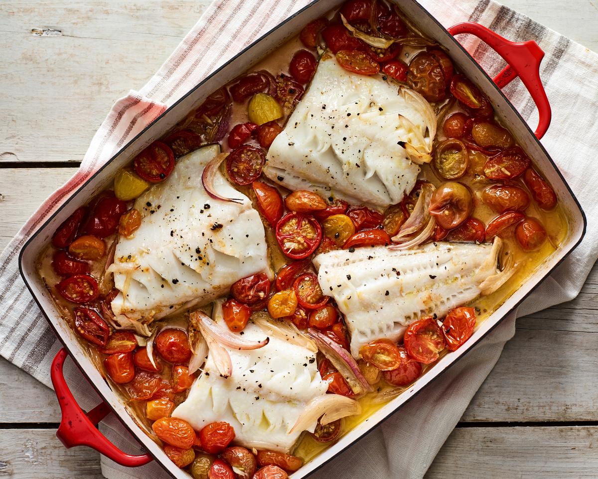 One-pan roasted fish with cherry tomatoes. You can throw this meal together for a quick dinner after work or put in front of friends on the weekend. Food styled by Barrett Washburne. (Andrew Purcell/The New York Times)