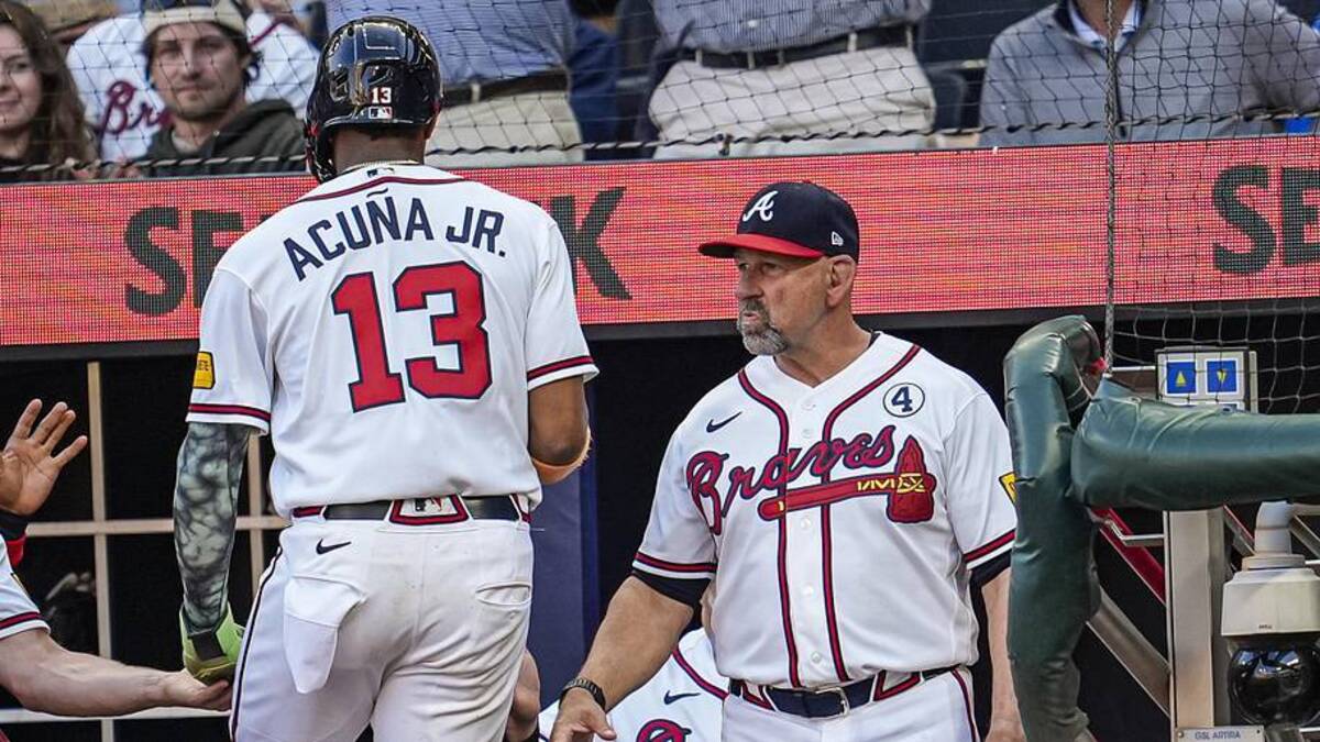  Jun 2, 2026; Cumberland, Georgia, USA; Atlanta Braves right fielder Ronald Acuna Jr. (13) reacts with manager Walt Weiss (22) after scoring a run against the Toronto Blue Jays during the first inning at Truist Park. | Dale Zanine-Imagn Images 