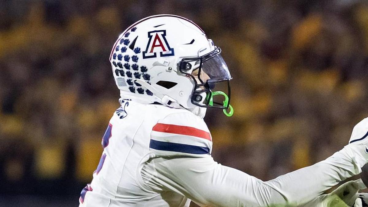  Nov 28, 2025; Tempe, Arizona, USA; Arizona Wildcats defensive back Treydan Stukes (2) intercepts the ball against Arizona State Sun Devils wide receiver Jaren Hamilton (16) in the second half during the 99th Territorial Cup at Mountain America Stadium. Mandatory Credit: Mark J. Rebilas-Imagn Images | Mark J. Rebilas-Imagn Images 