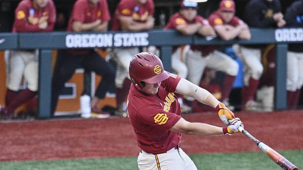  May 31, 2025; Corvallis, OR, USA; USC infielder Ethan Hedges (15) hits the ball in the seventh inning against Saint Mary's at the NCAA Corvallis Regional at Goss Stadium. Mandatory Credit: Troy Wayrynen-Imagn Images | Troy Wayrynen-Imagn Images 