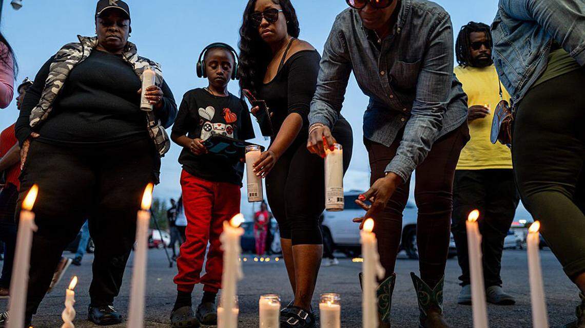 People attend a candlelight vigil in Shreveport, Louisiana, on Sunday after eight children were killed and two women wounded during a domestic violence incident earlier in the day. Shamar Elkins, 31, was shot dead after a police chase, authorities said.