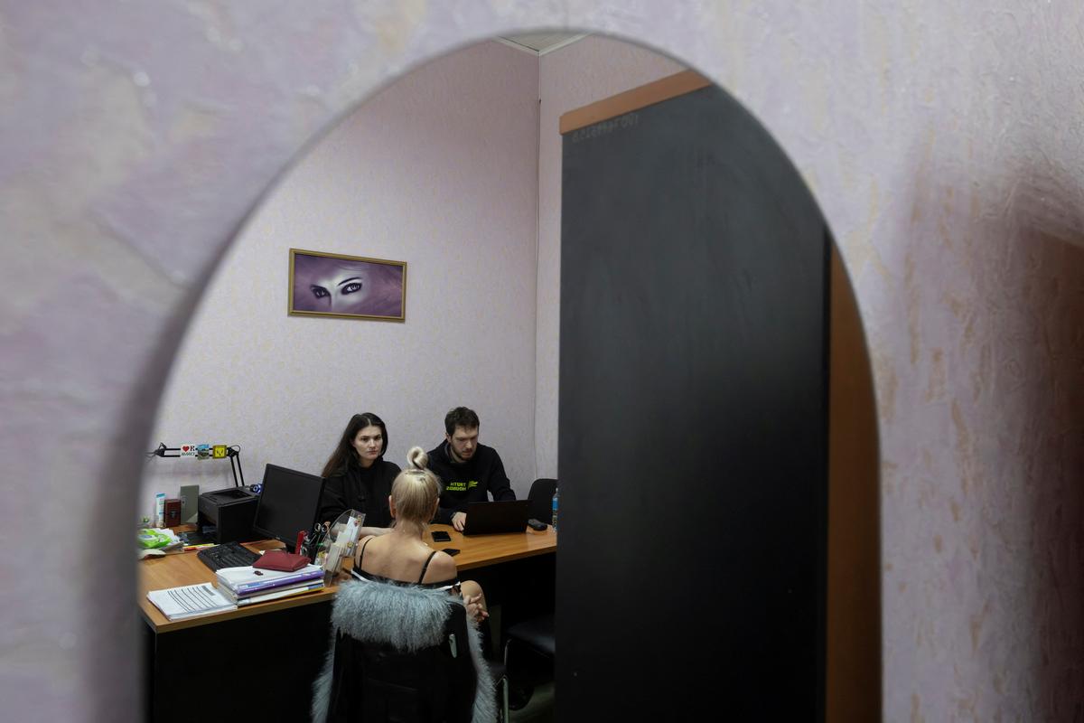 War-crimes investigators Roksolana Makar and Oleksii Starynets, from the Ukrainian nonprofit Truth Hounds, interview a woman who says she was tortured and raped by occupying Russian forces in 2022, in Izium, Ukraine, January 29, 2026. REUTERS/Thomas Peter