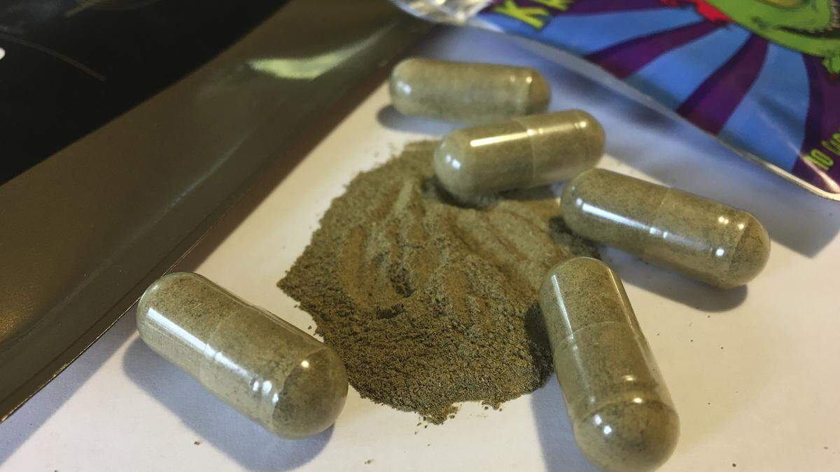 In this Sept. 27, 2017 photo, kratom capsules are displayed in Albany, N.Y. Kratom, an herbal supplement promoted as an alternative pain remedy, contains the same chemicals found in opioids. It is derived from a tree in the coffee family that is native to Southeast Asia.