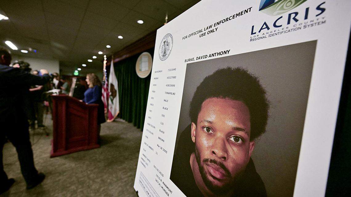 A picture of singer D4vd is seen during a news briefing on the case against him in Los Angeles on Monday. D4vd, whose real name is David Burke, was arrested in connection to the murder of a teenage girl whose dismembered body was found in the trunk of a car registered in the artist's name.