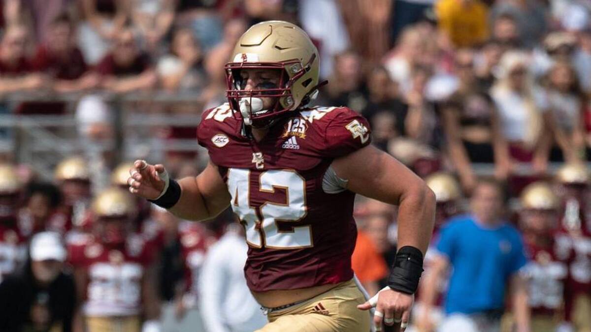  Holy Cross's Phoenix Dickson runs past Boston College's Vinny DePalma to bring up a 1st and 1 on Saturday September 9, 2023 at Alumni Stadium in Newton. | Photo/Alan Arsenault / USA TODAY NETWORK 