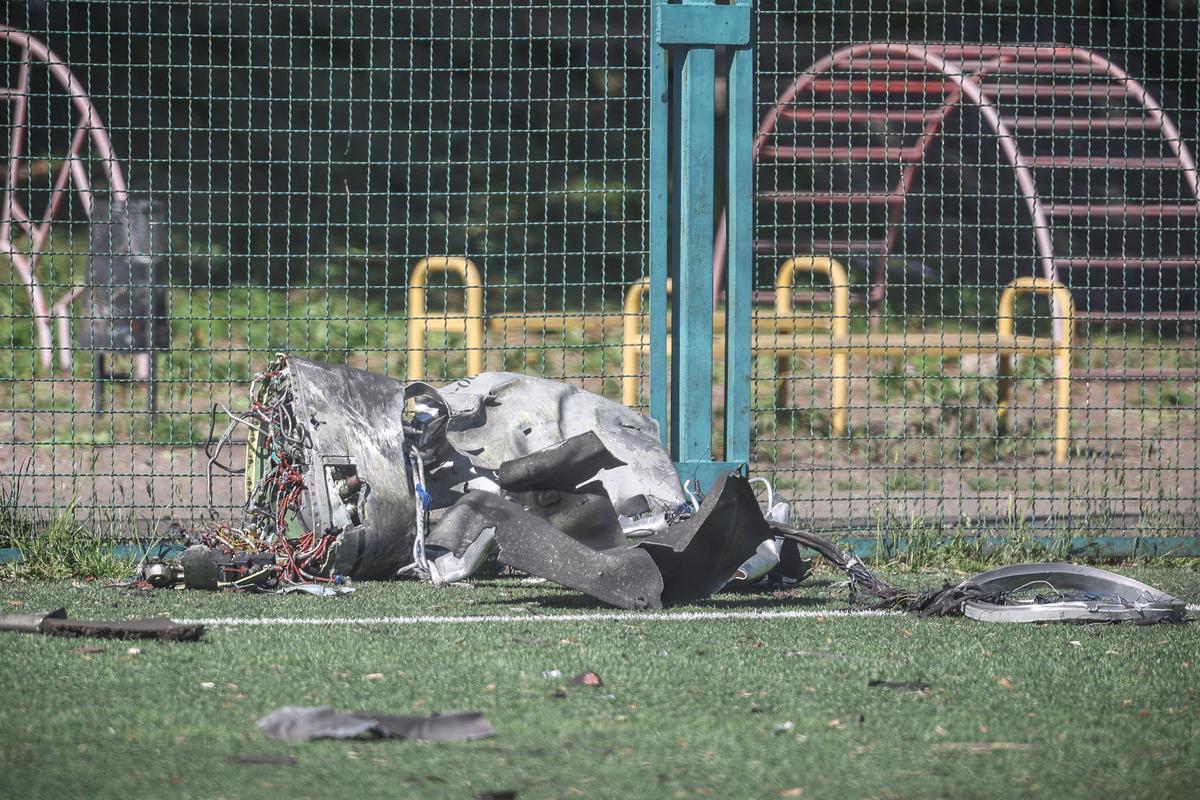 Remains of a Russian cruise missile appear at a football field near a school, which was hit during a Russian missile and drone strike, amid Russia's attack on Ukraine, in Kyiv, Ukraine May 24, 2026. REUTERS/Alina Smutko