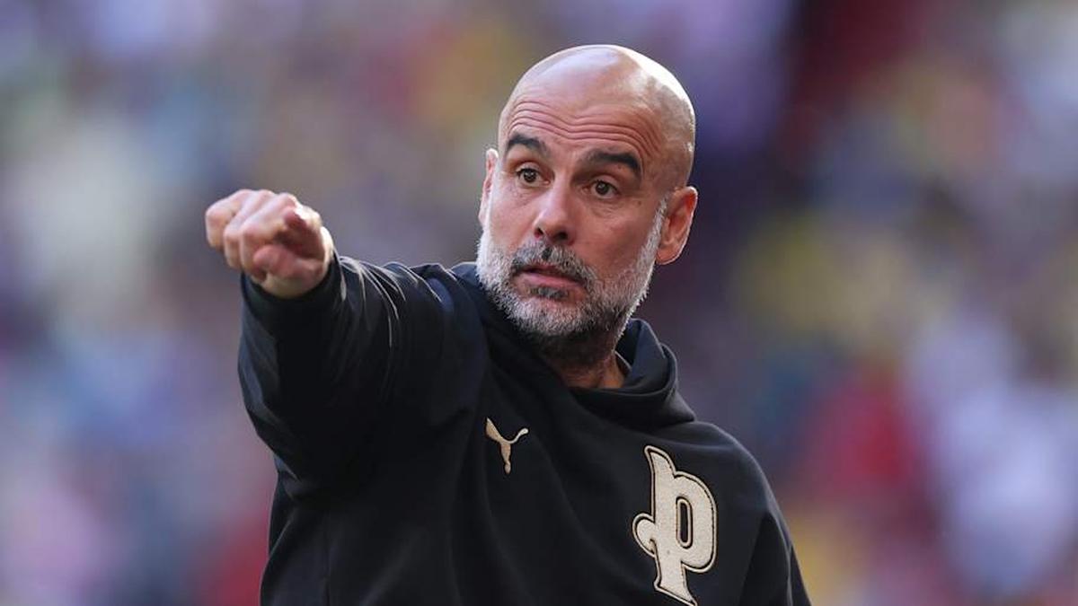  Pep Guardiola has a contract until 2027. | Michael Regan-The FA/The FA/Getty Images 