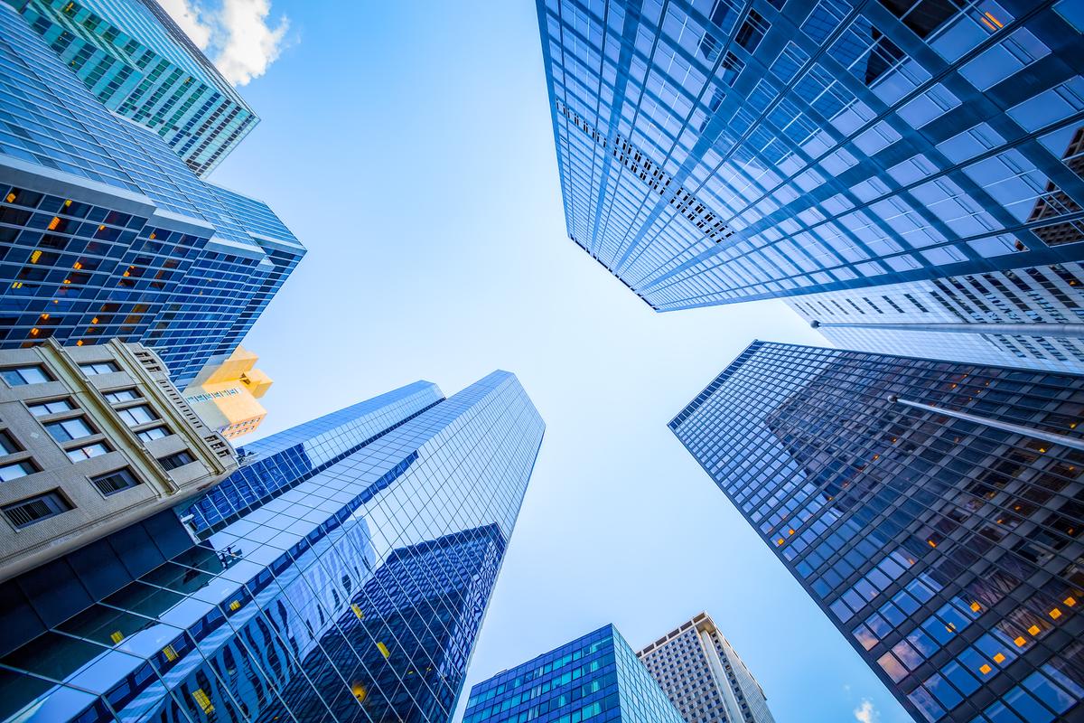  An upward view of skyscrapers in Manhattan’s financial district in New York City. 