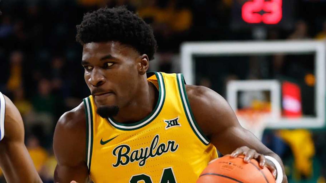  Feb 10, 2026; Waco, Texas, USA; Baylor Bears guard Tounde Yessoufou (24) drives to the basket as BYU Cougars guard Robert Wright III (1) defends during the first half at Paul and Alejandra Foster Pavilion. Mandatory Credit: Chris Jones-Imagn Images | Chris Jones-Imagn Images 