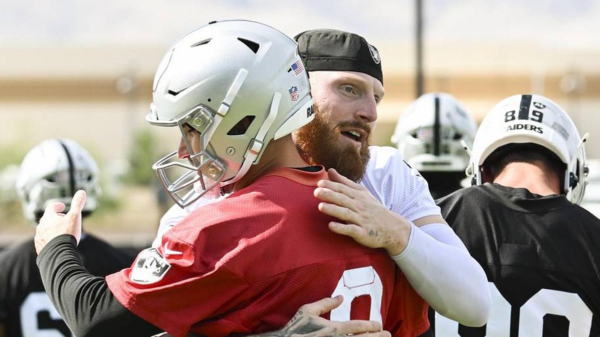  Jun 3, 2026; Henderson, NV, USA; Las Vegas Raiders defensive end Maxx Crosby (98) hugs quarterback Kirk Cousins (8) during organized team activities at Intermountain Health Performance Center. Mandatory Credit: Candice Ward-Imagn Images | Candice Ward-Imagn Images 