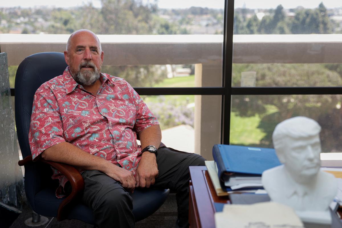 Pat Burns, a pro-Trump councilman for the City of Huntington Beach, poses in the MAGA stronghold of Huntington Beach, California, U.S. May 27, 2026.  REUTERS/Caroline Brehman