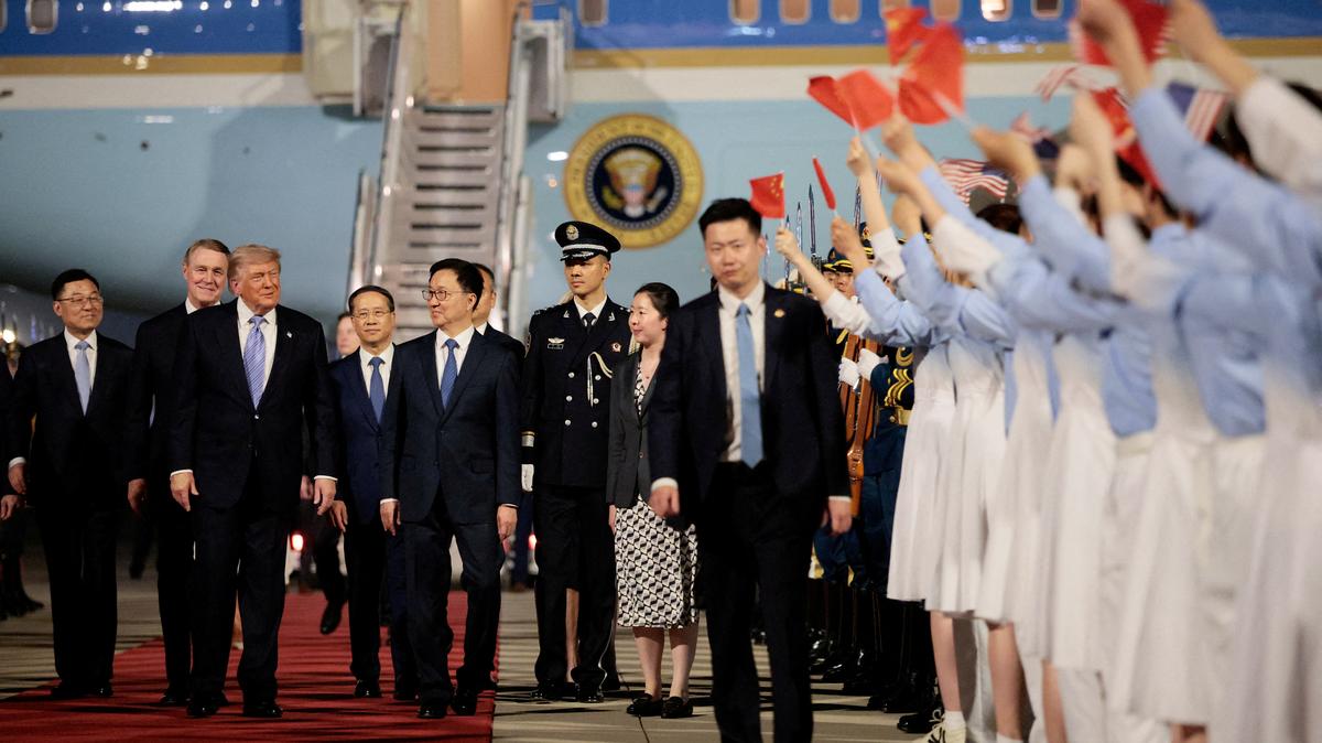FILE PHOTO: U.S. President Donald Trump walks with Chinese Vice President Han Zheng during an arrival ceremony at Beijing Capital International Airport, in Beijing, China, May 13, 2026. REUTERS/Evan Vucci/File Photo