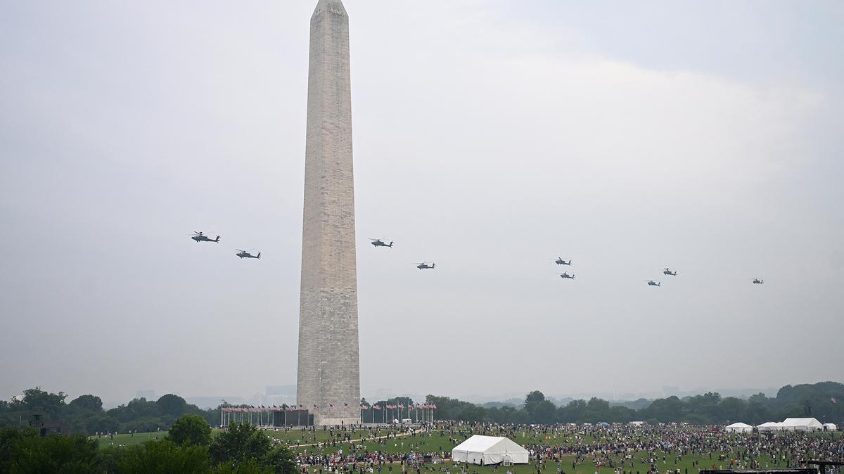AH-64 Apache helicopters fly past the Washington monument during the Army 250th Anniversary Parade in Washington, D.C., on June 14, 2025. US President Donald Trump reveled in a long dreamt-of military parade on his 79th birthday Saturday, as demonstrators across the country branded him a dictator in the biggest protests since his return to power. (Alex Wroblewski/AFP via Getty Images/TNS)