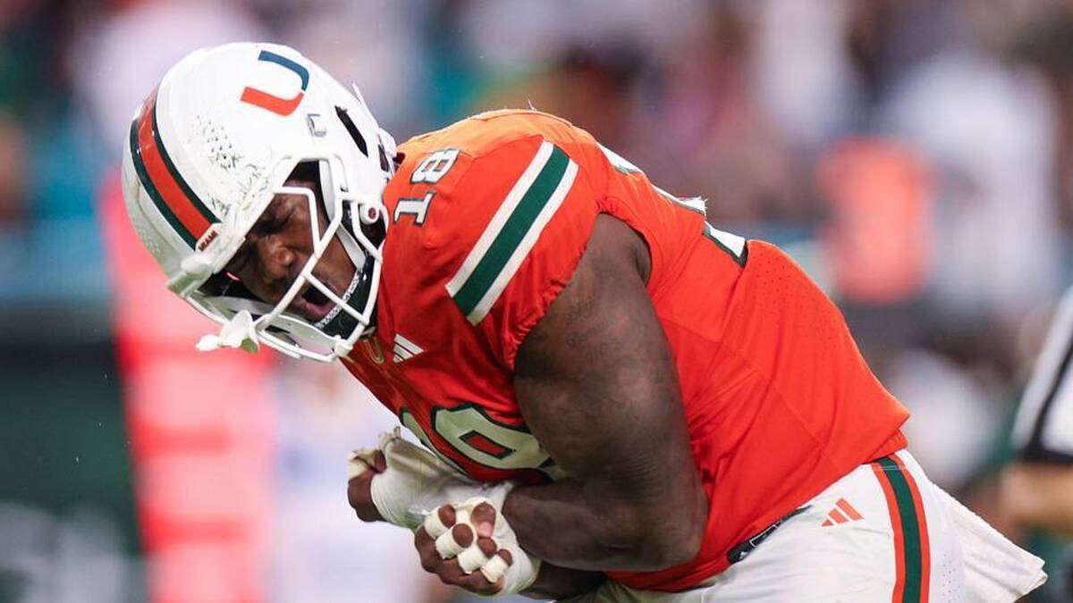  Sep 13, 2025; Miami Gardens, Florida, USA; Miami Hurricanes defensive lineman Armondo Blount (18) reacts after a play against the South Florida Bulls in the second quarter at Hard Rock Stadium. Mandatory Credit: Nathan Ray Seebeck-Imagn Images | IMAGN IMAGES via Reuters Connect 