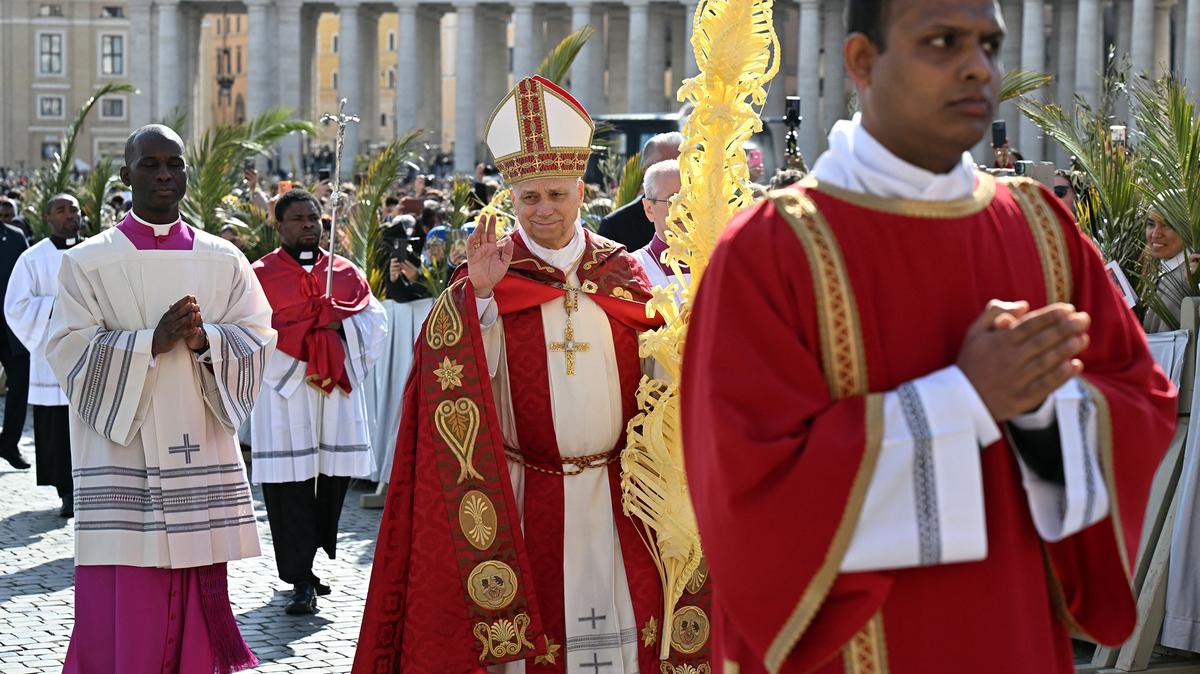 Pope Leo XIV waves as he arrives to lead a mass for Palm Sunday at St Peter's Square in the Vatican on Sunday, March 29, 2026. An ethics analysis contrasting Pope Leo’s call for mercy with Trump’s threats to Iran, exploring justice, fury and the moral limits of wartime conduct.