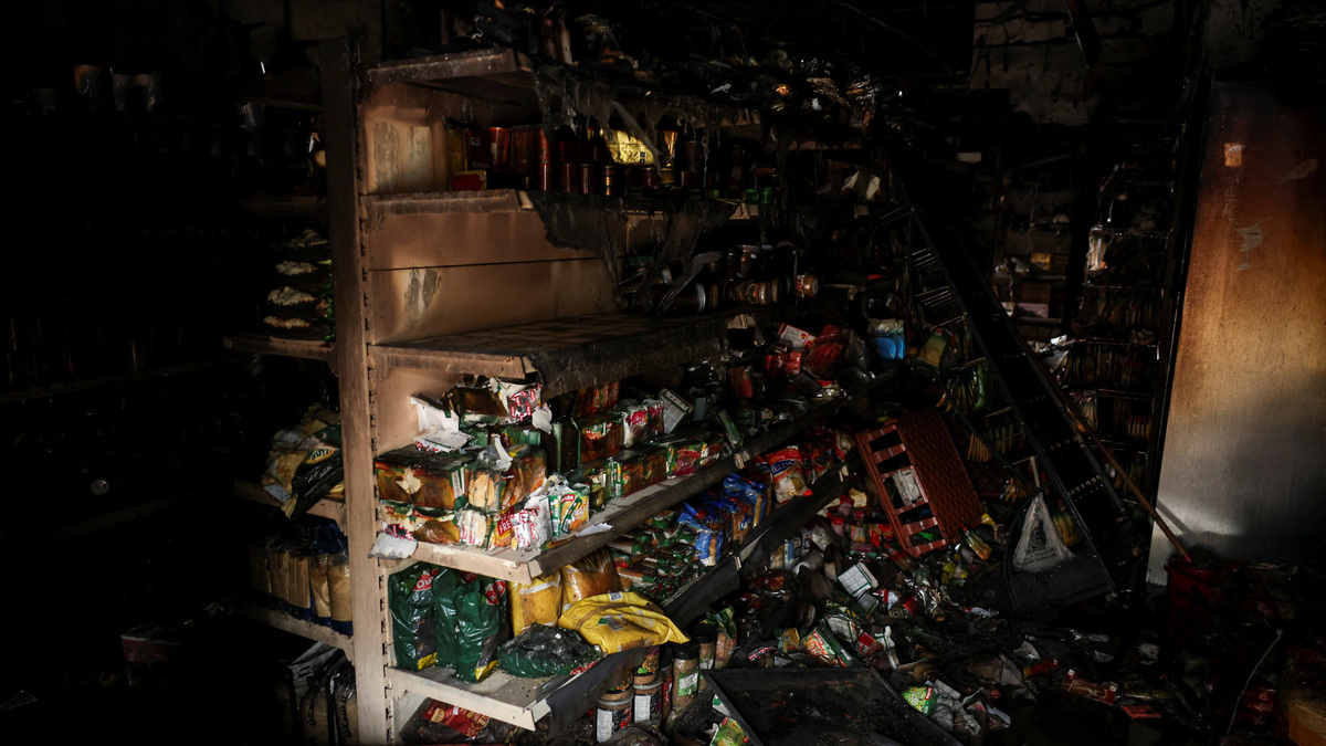 Destroyed produce at Sham supermarket, which was burnt down in the aftermath of anti-immigrant protests following a knife attack on June 8, which left a man seriously injured and prompted police to declare a critical incident, in Belfast, Northern Ireland, June 11, 2026. REUTERS/Isabel Infantes