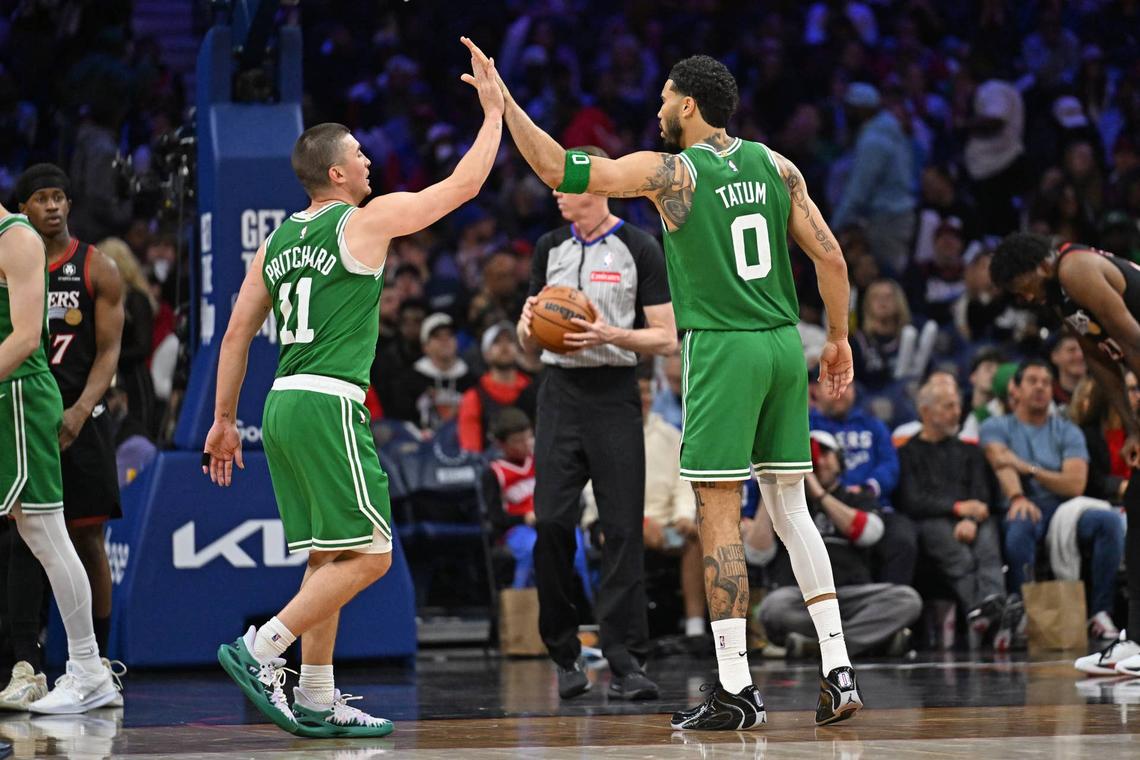  Boston Celtics guard Payton Pritchard (11) and forward Jayson Tatum (0) high five each other. 