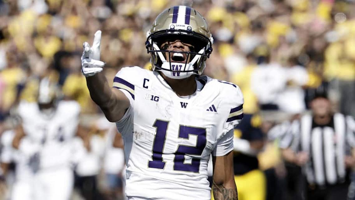  Oct 18, 2025; Ann Arbor, Michigan, USA; Washington Huskies wide receiver Denzel Boston (12) celebrates after he makes a reception in the first half against the Michigan Wolverines at Michigan Stadium. Mandatory Credit: Rick Osentoski-Imagn Images | Rick Osentoski-Imagn Images 