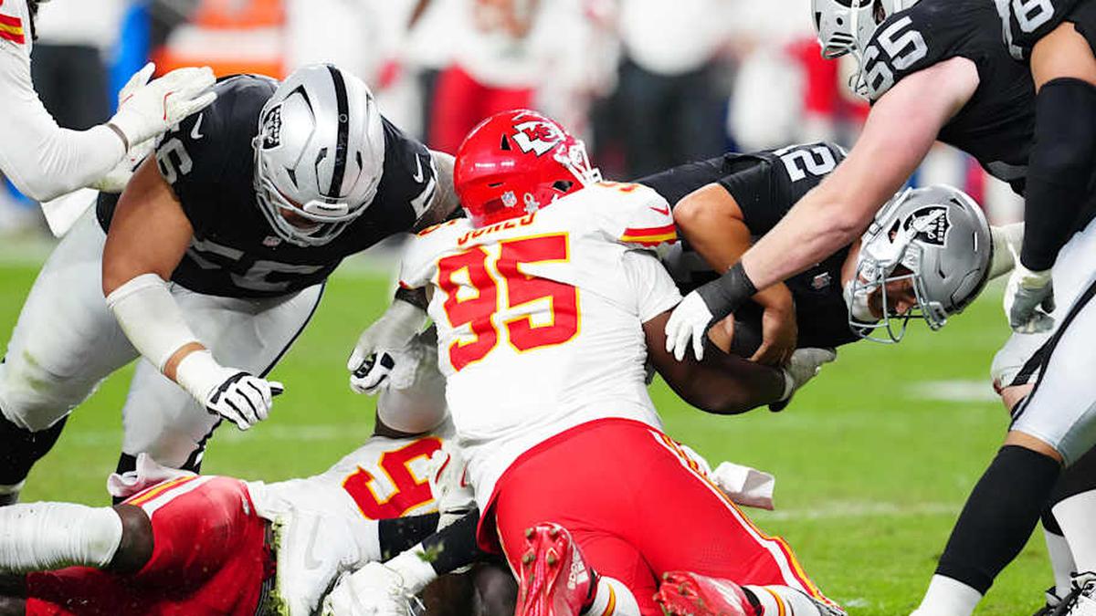  Jan 4, 2026; Paradise, Nevada, USA; Las Vegas Raiders quarterback Aidan O'Connell (12) is sacked by Kansas City Chiefs defensive tackle Chris Jones (95) during the fourth quarter at Allegiant Stadium. Mandatory Credit: Stephen R. Sylvanie-Imagn Images | Stephen R. Sylvanie-Imagn Images 