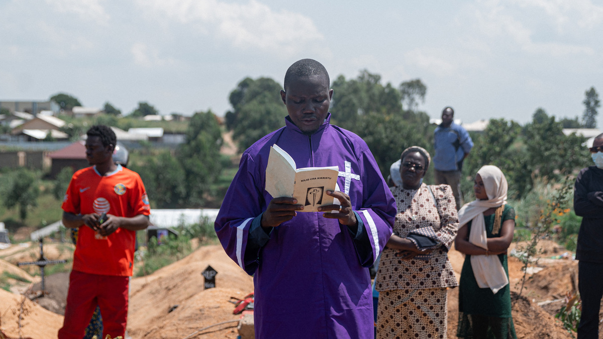 A priest conducts a blessing ceremony at Mbiyo cemetery for a fourth orphan who died from Ebola virus disease at an orphanage in Bunia, Ituri Province, June 19, 2026, in the Democratic Republic of Congo. (Jospin Mwisha/AFP/Getty Images/TNS)