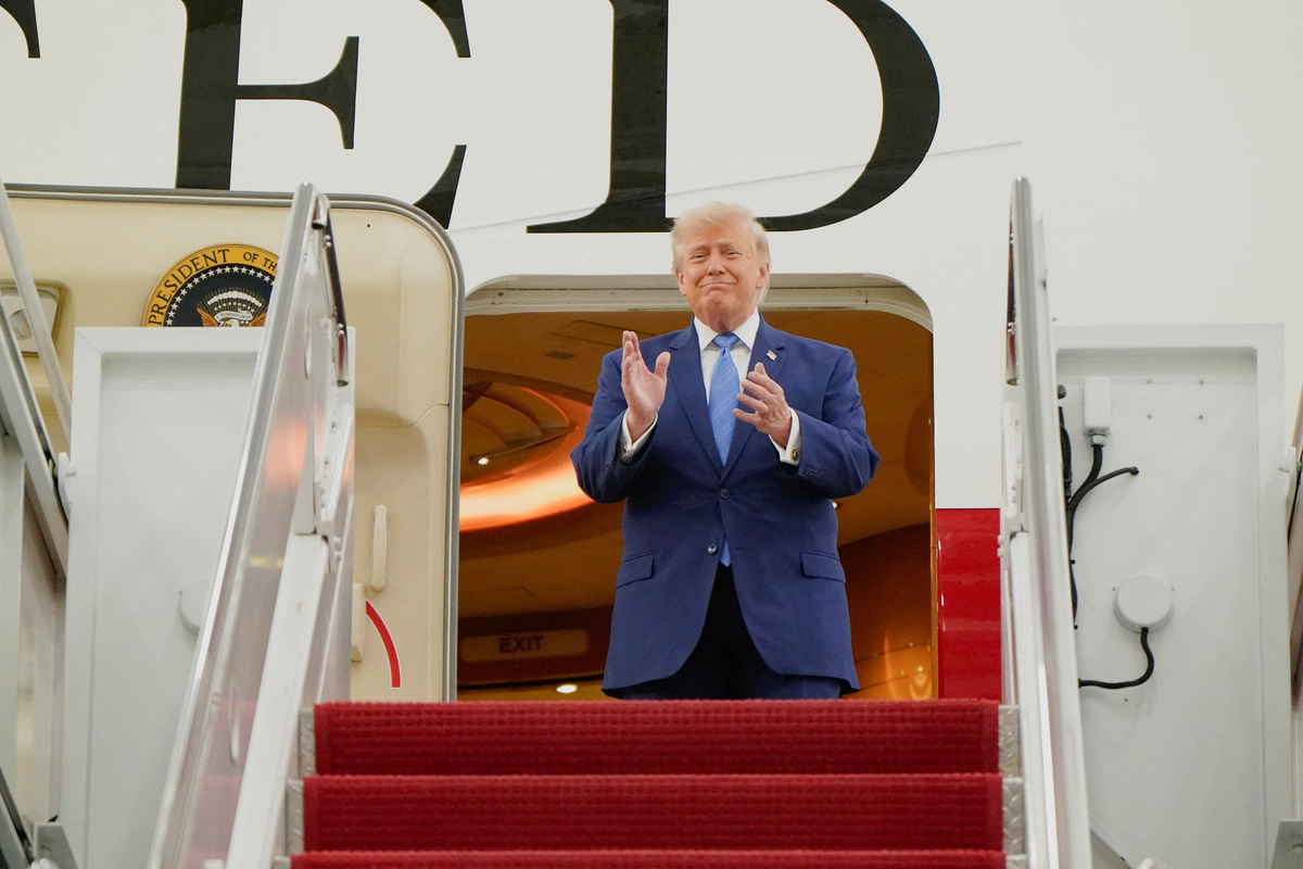 U.S. President Donald Trump applauds as he tours the VC-25B aircraft gifted by Qatar that will be used as Air Force One, at Joint Base Andrews, Maryland, U.S., June 19, 2026. REUTERS/Elizabeth Frantz