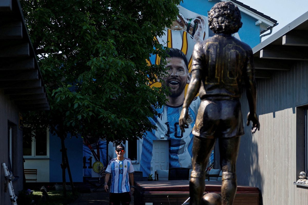 Miloslav "Curby" Urbanec, a 51-year-old Czech national and an ardent Argentine football fan, walks through a yard of his house in the village of Bukovka near the town of Lazne Bohdanec, Czech Republic, June 29, 2026. REUTERS/David W Cerny