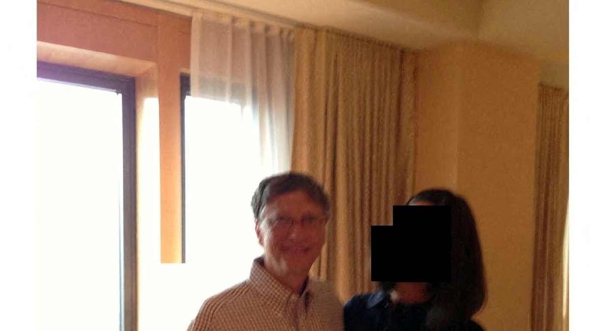FILE PHOTO: Bill Gates appears with a woman, whose identity has been obscured, in this image from the Epstein estate released by House Oversight Committee Democrats in Washington, D.C., U.S., on December 18, 2025. House Oversight Committee Democrats/Handout via REUTERS/File Photo