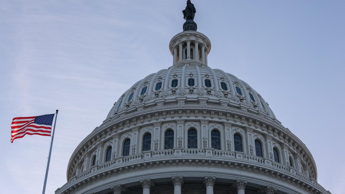 An American flag flies outside the U.S. Capitol building at sunset, as members of Congress work to resolve a dispute over immigration enforcement and avert a looming partial government shutdown, on Capitol Hill in Washington, D.C., U.S., January 30, 2026. REUTERS/Kylie Cooper