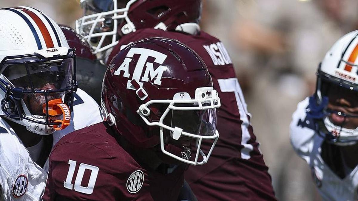  Sep 27, 2025; College Station, Texas, USA; Texas A&M Aggies quarterback Marcel Reed (10) is tackled by Auburn Tigers defensive end Keyron Crawford (24) during the second quarter at Kyle Field. Mandatory Credit: Troy Taormina-Imagn Images | Troy Taormina-Imagn Images 