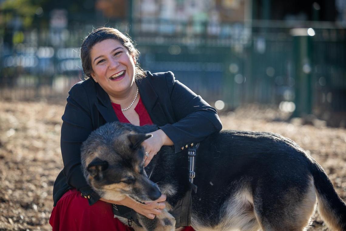 Staycee Dains pets a dog at Long Beach dog park in 2024. A former leader of Los Angeles Department of Animal Services, Dains was hired by the city of Sacramento in May 2025. 