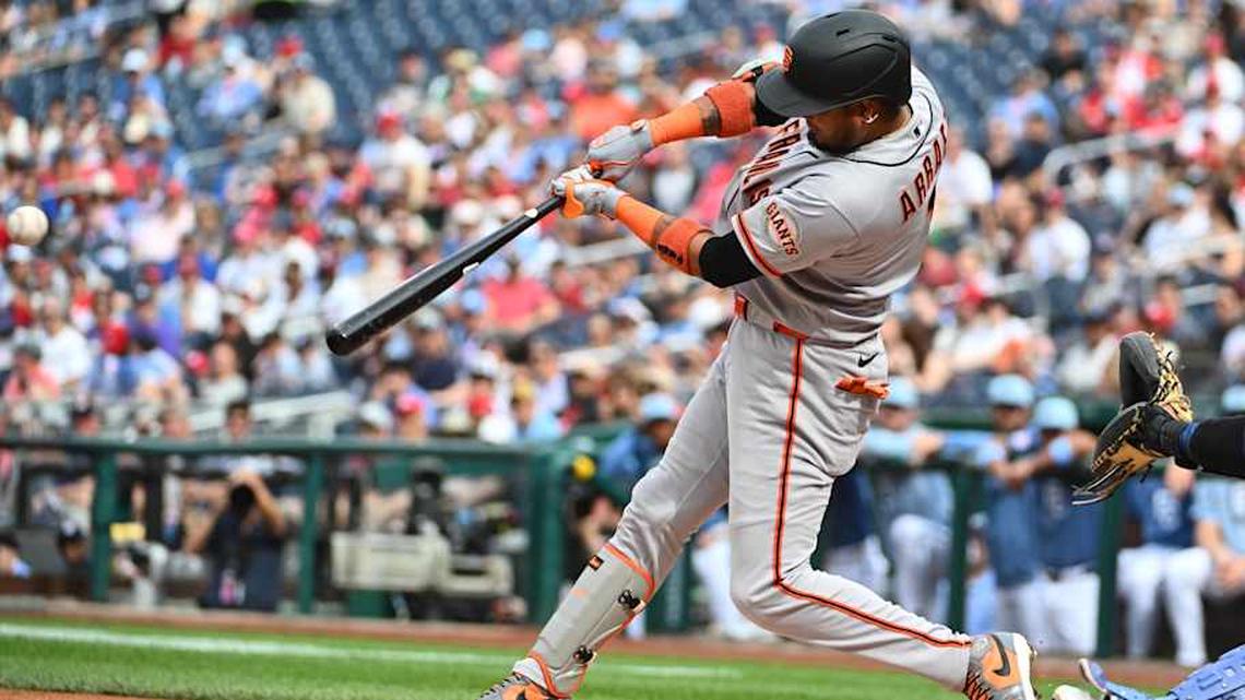  Apr 18, 2026; Washington, District of Columbia, USA; San Francisco Giants second baseman Luis Arraez (1) singles against the Washington Nationals during the first inning at Nationals Park. | Brad Mills-Imagn Images 