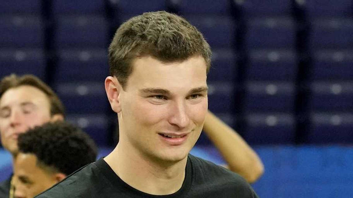  Feb 28, 2026; Indianapolis, IN, USA; Indiana quarterback Fernando Mendoza (QB11) greets Alabama quarterback Ty Simpson (QB17) during the NFL Scouting Combine at Lucas Oil Stadium. Mandatory Credit: Kirby Lee-Imagn Images | Kirby Lee-Imagn Images 