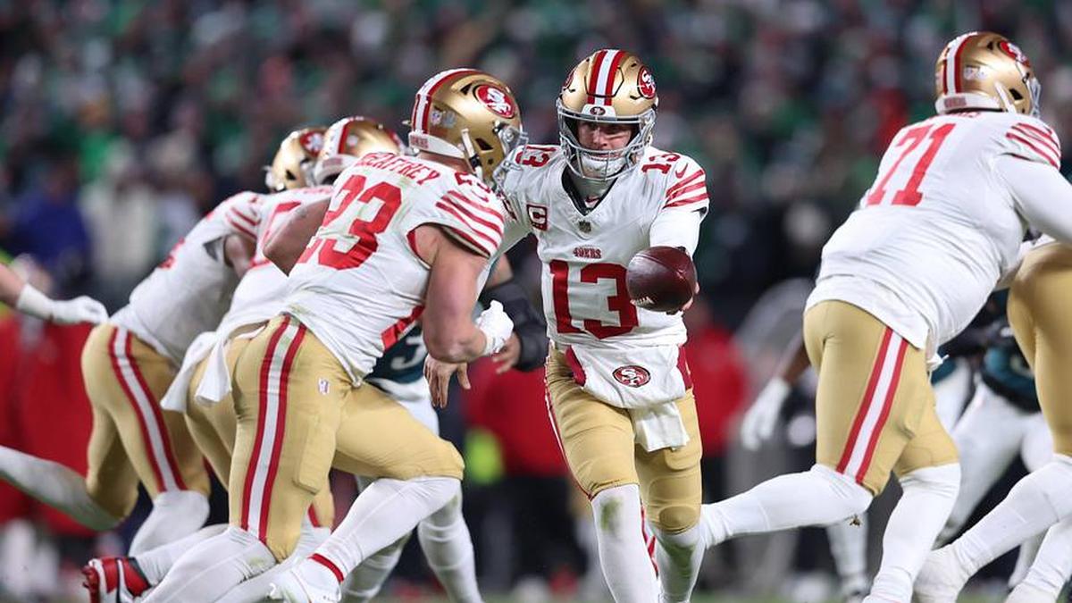  Jan 11, 2026; Philadelphia, PA, USA; San Francisco 49ers quarterback Brock Purdy (13) hands off the ball to running back Christian McCaffrey (23) against the Philadelphia Eagles during the second quarter in an NFC Wild Card Round game at Lincoln Financial Field. Mandatory Credit: Bill Streicher-Imagn Images | Bill Streicher-Imagn Images 