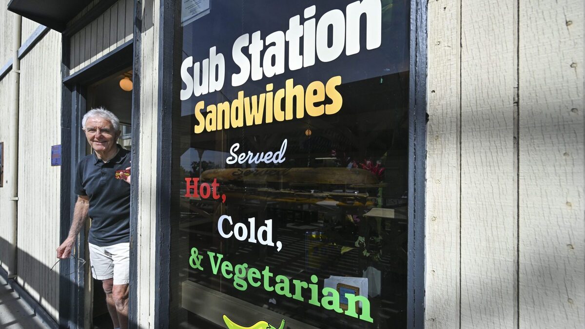 Sub Station owner Richard Munio in the doorway of his store Monday, Feb. 23, 2026, near the UC Riverside campus in Riverside. The university has slated the adjoining housing and retail property, Bannockburn Village, where Sub Station has operated since 1972, for demolition. (Photo by Anjali Sharif-Paul, The Sun/SCNG)