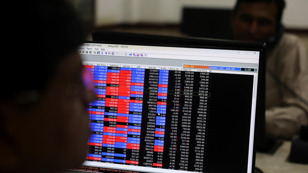 Brokers trade at their desks inside a stock brokerage firm in Mumbai, India, August 28, 2025. REUTERS/Francis Mascarenhas