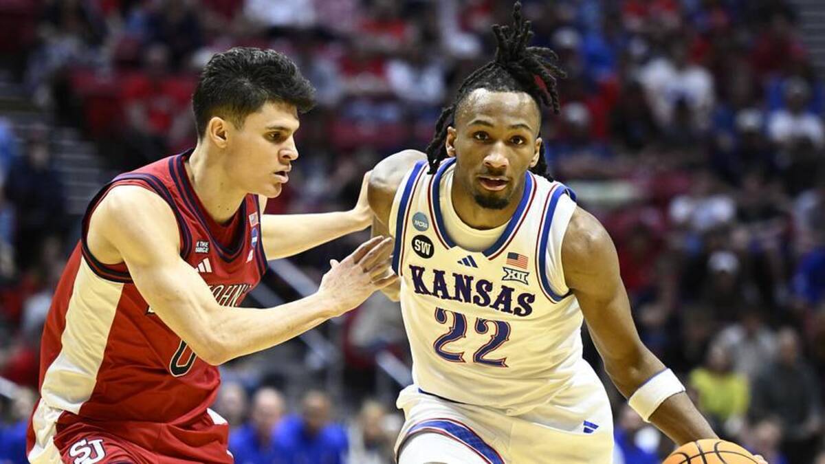  Mar 22, 2026; San Diego, CA, USA; Kansas Jayhawks guard Darryn Peterson (22) controls the ball against St. John's Red Storm guard Dylan Darling (0) in the first half during a second round game of the men's 2026 NCAA Tournament at Viejas Arena. | Denis Poroy-Imagn Images 