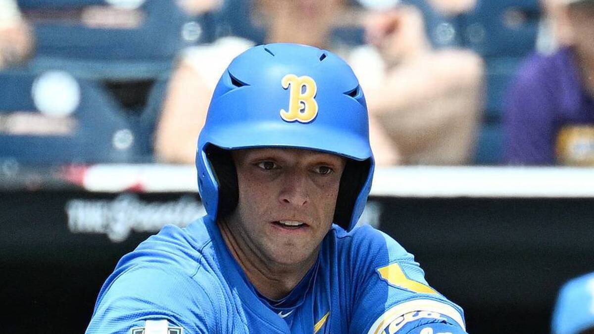  Jun 14, 2025; Omaha, Neb, USA; UCLA Bruins shortstop Roch Cholowsky (1) bunts in a run against the Murray State Racers during the fourth inning at Charles Schwab Field. Mandatory Credit: Steven Branscombe-Imagn Images | IMAGN IMAGES via Reuters Connect 
