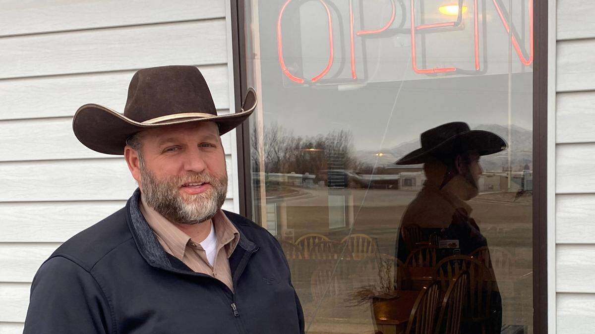 Ammon Bundy, who led the armed occupation of the Malheur National Wildlife Refuge in 2016, stands in front of a restaurant Jan. 27, 2021, in Emmett, Idaho, where he lives with his wife and six children. Bundy opposes COVID-19 restrictions that he says hurt business for restaurants such as this one in in Emmett.