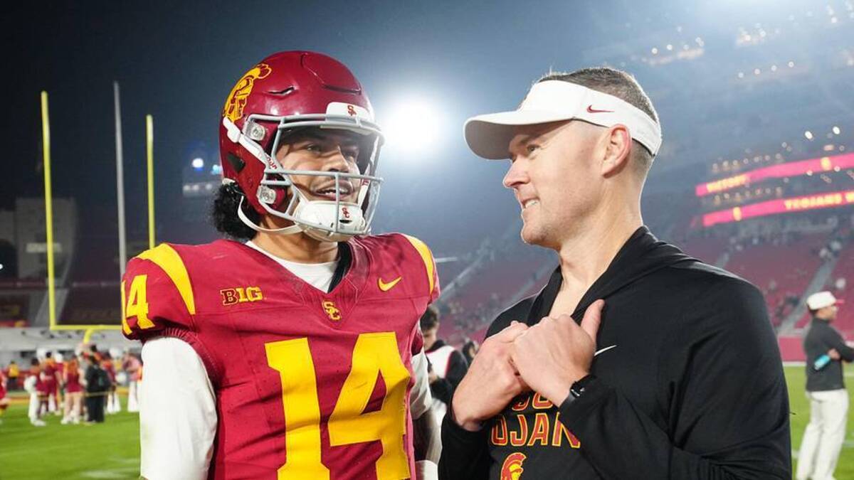  Nov 29, 2025; Los Angeles, California, USA; Southern California Trojans quarterback Jayden Maiava (14) and head coach Lincoln Riley react after the game against the UCLA Bruins at United Airlines Field at Los Angeles Memorial Coliseum. Mandatory Credit: Kirby Lee-Imagn Images | Kirby Lee-Imagn Images 