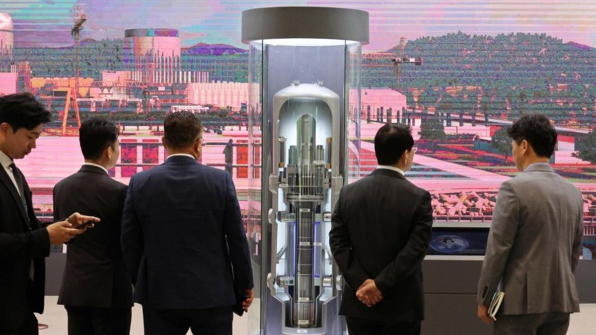 Visitors look at a South Korea-developed innovative small modular reactor model during this year's International Nuclear Energy Expo at the BEXCO exhibition center in Busan, South Korea, 22 April 2026. Photo by YONHAP / EPA