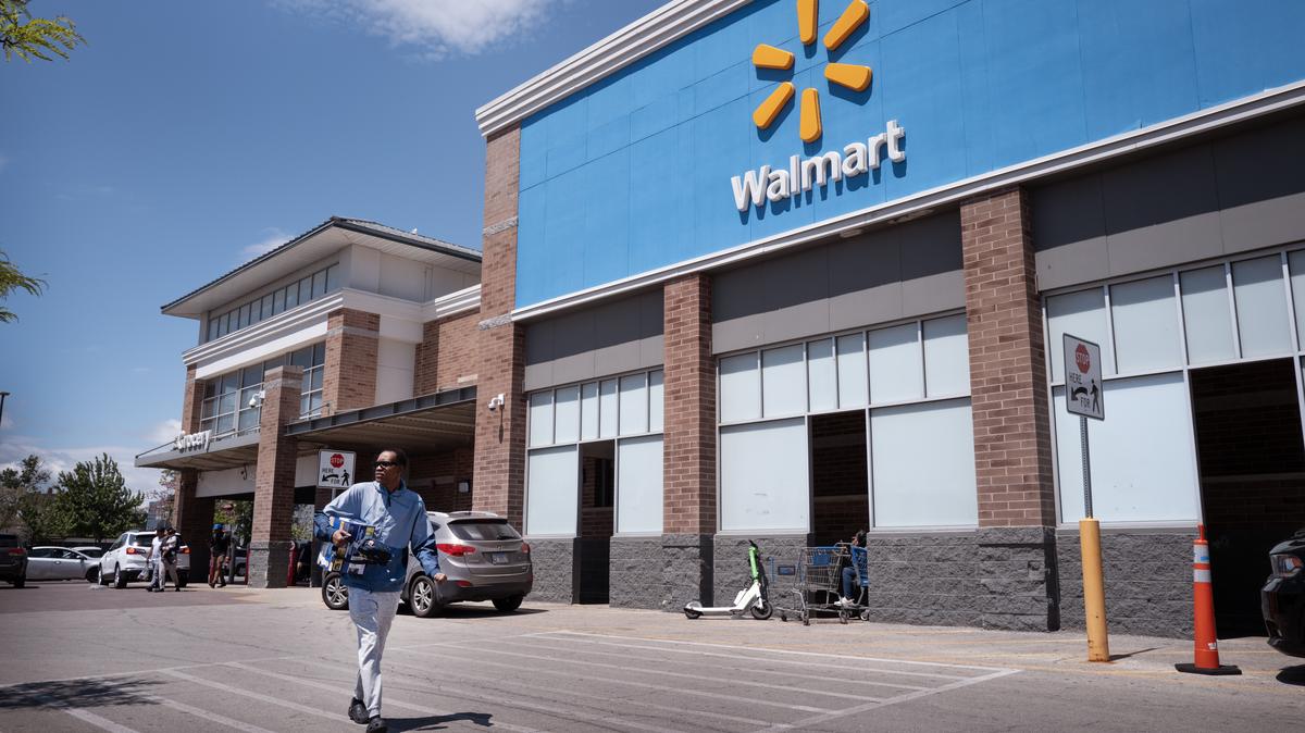 Walmart To Layoff And Relocate 1,000 Positions. Customers shop at a Walmart store on May 13, 2026 in Chicago, Illinois. 