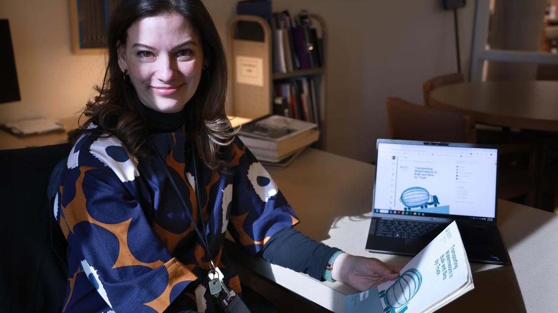 Rachel Cole, curator at the Northwestern University Transportation Library, with a whimsical cover from a 1982 Department of Agriculture report at the Northwestern University Library in Evanston, Illinois on March 19, 2026. (Antonio Perez/Chicago Tribune/TNS)