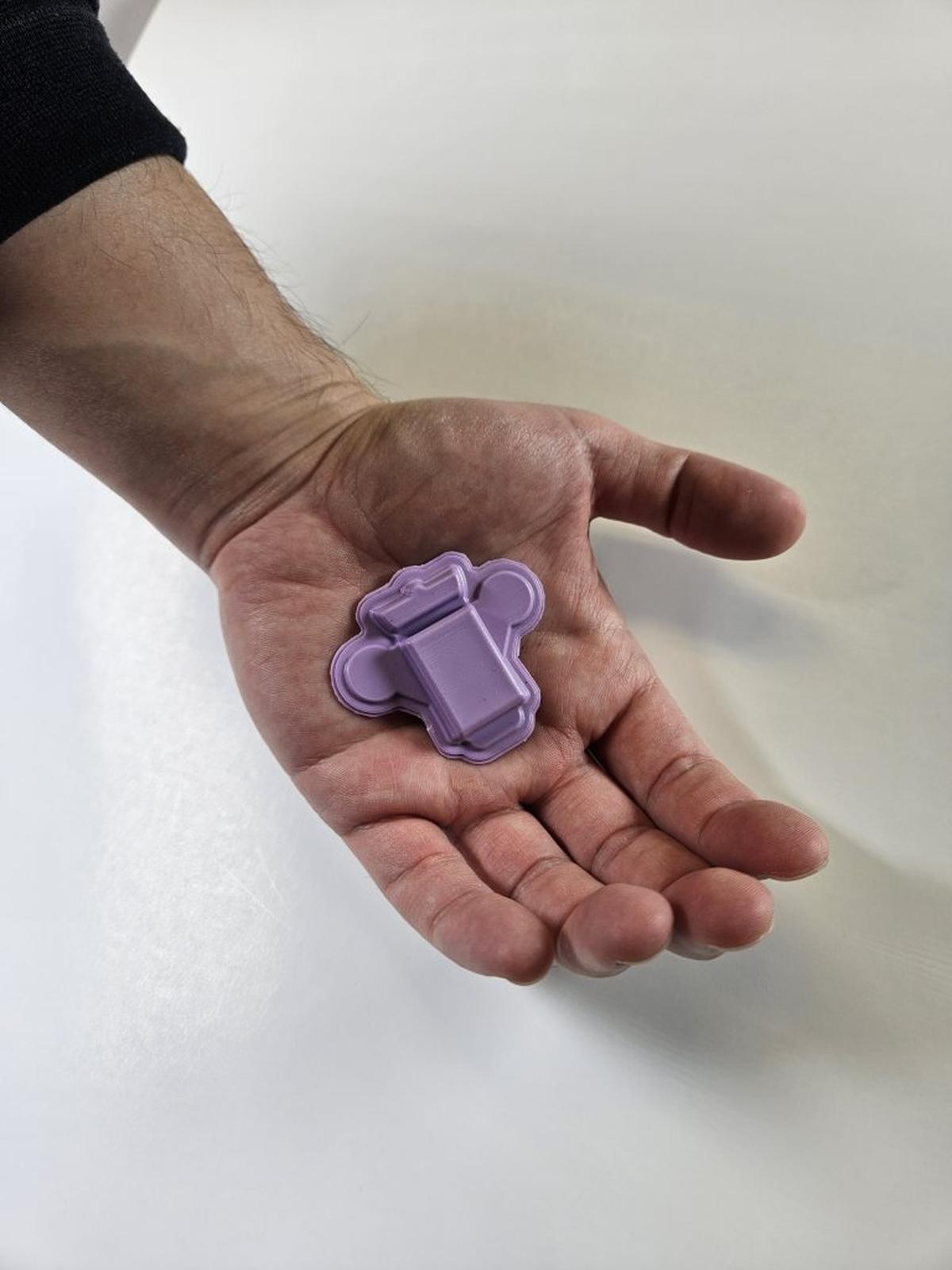  Wearable polygraph device in the palm of a hand for scale. (John A. Rogers / Northwestern University via SWNS) 